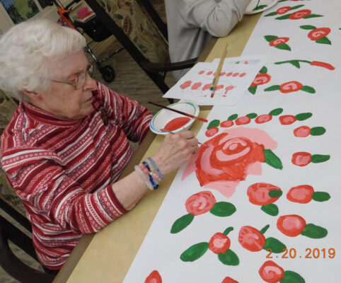 woman painting decorations
