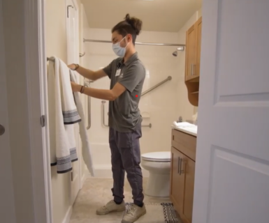 Caregiver performing light housekeeping tasks in an Illinois home.